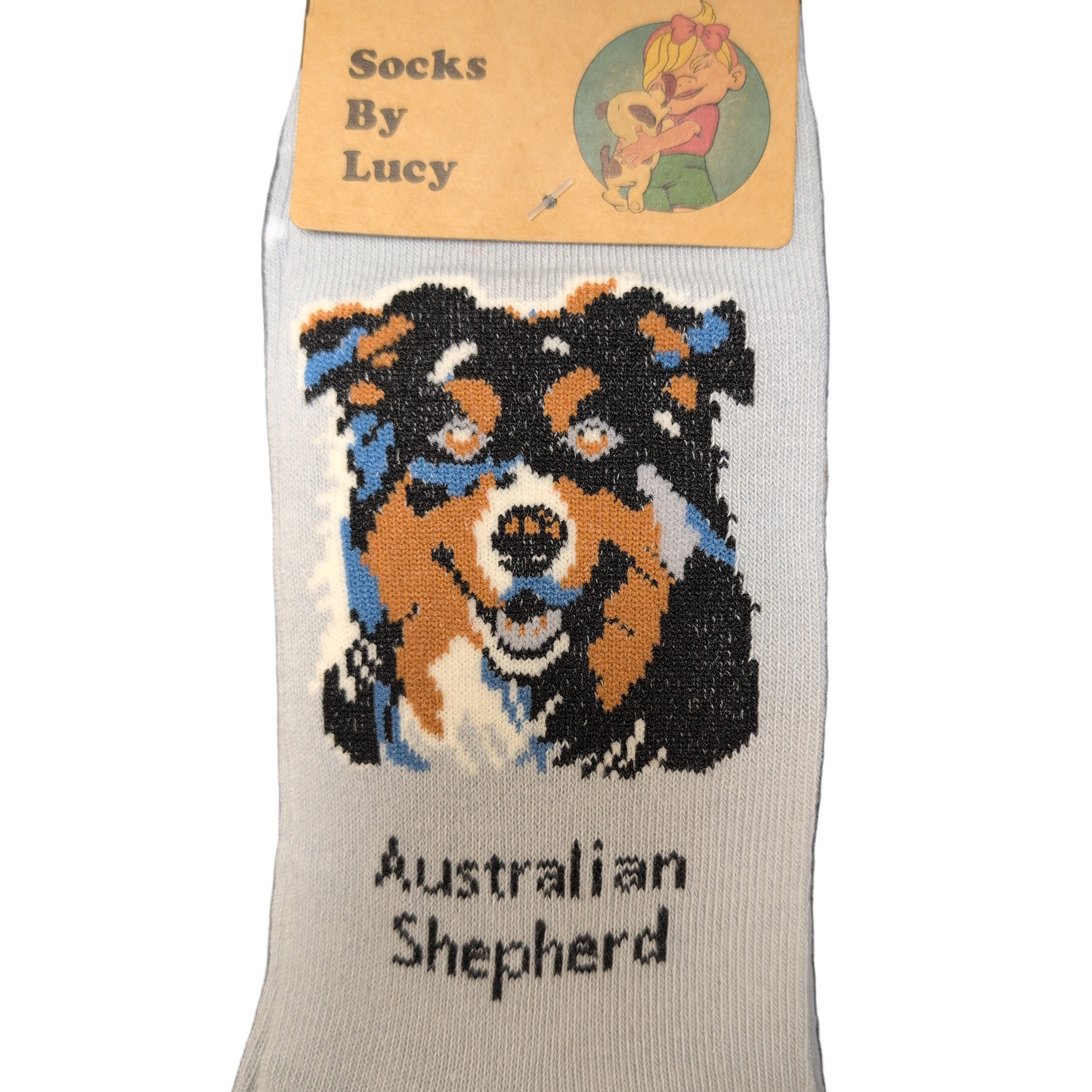 Sock with Australian Shepherd design and 'Socks By Lucy' label on a white background