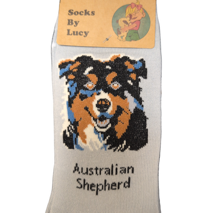 Sock with Australian Shepherd design and 'Socks By Lucy' label on a white background
