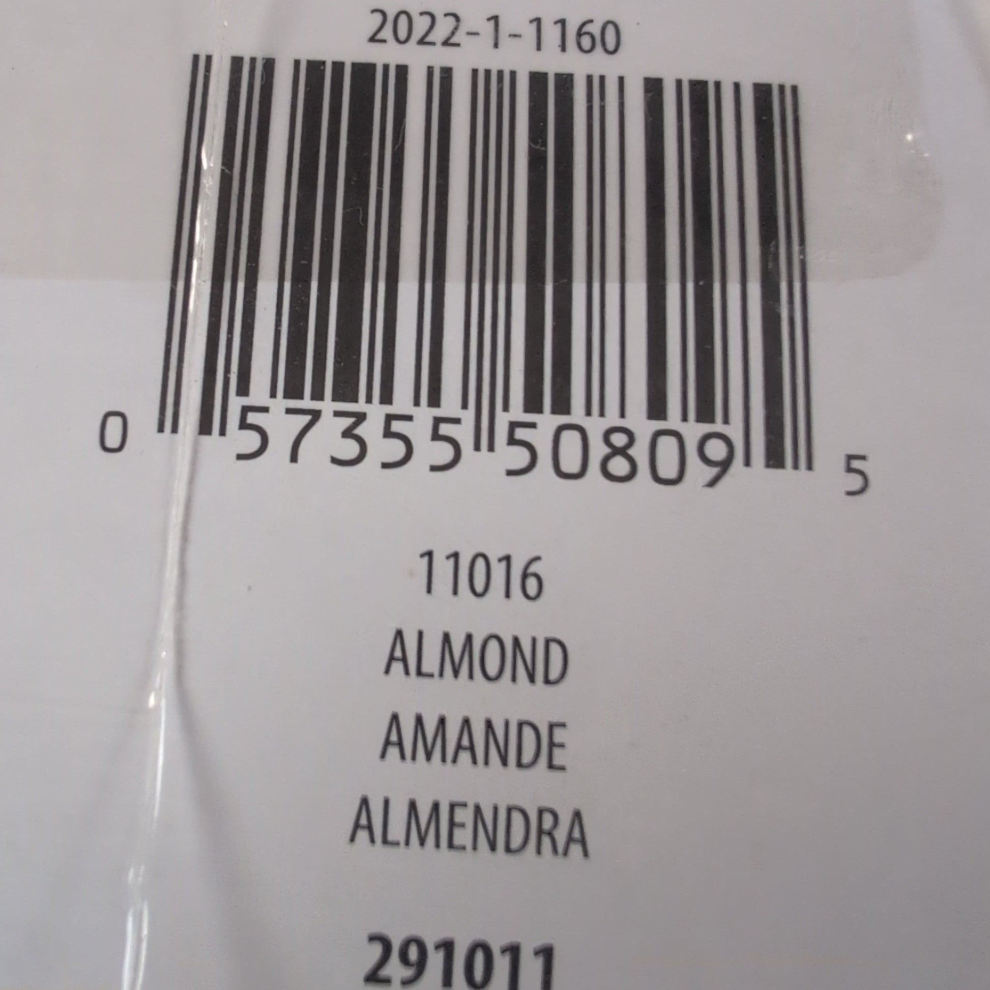 Bar code label on a product packaging with text and numbers.