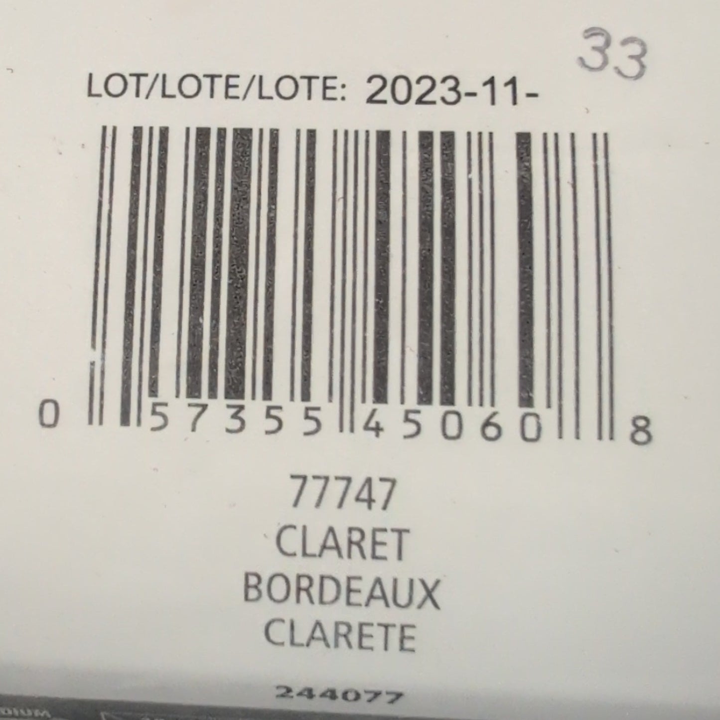 Close-up of a Patons yarn label with a barcode and text.