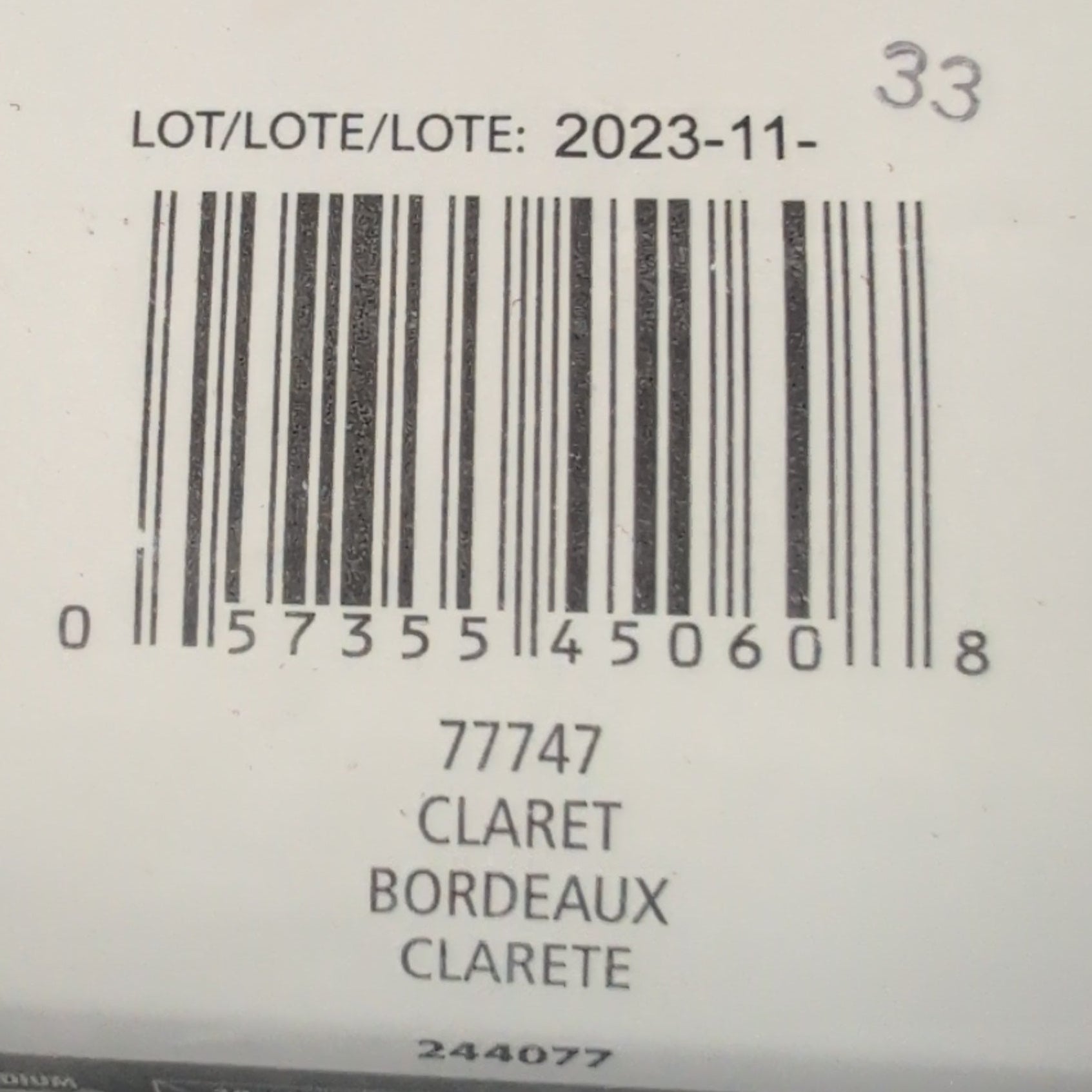 Close-up of a Patons yarn label with a barcode and text.