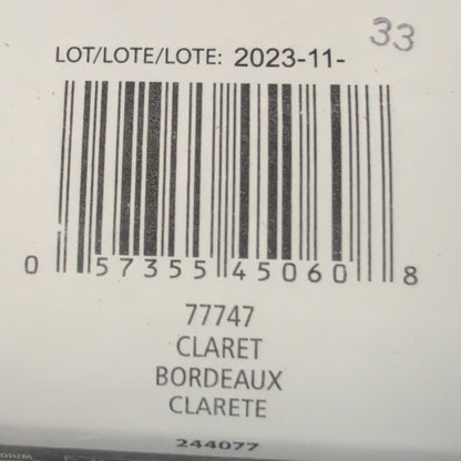 Close-up of a Patons yarn label with a barcode and text.