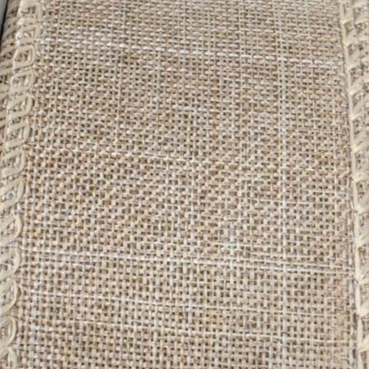 Close-up of textured beige fabric with a subtle pattern