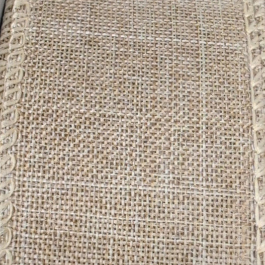 Close-up of textured beige fabric with a subtle pattern