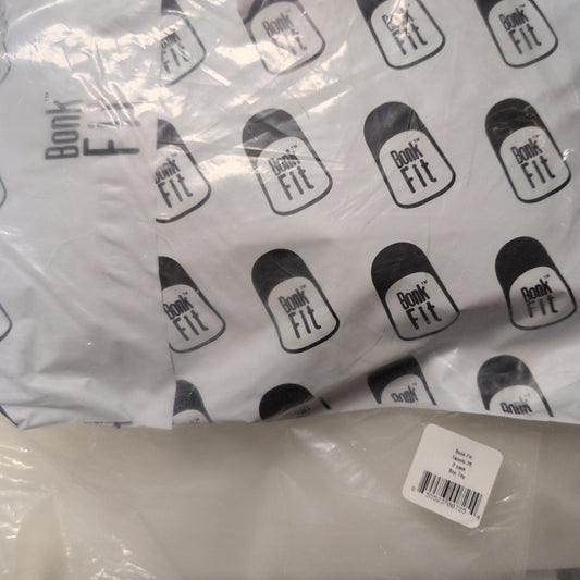 White product with black branding labels on a clear plastic bag.