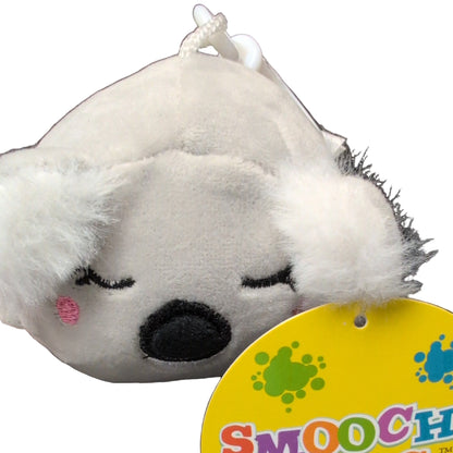 Plush dog toy with a tag displaying 'Smooch' on a white background