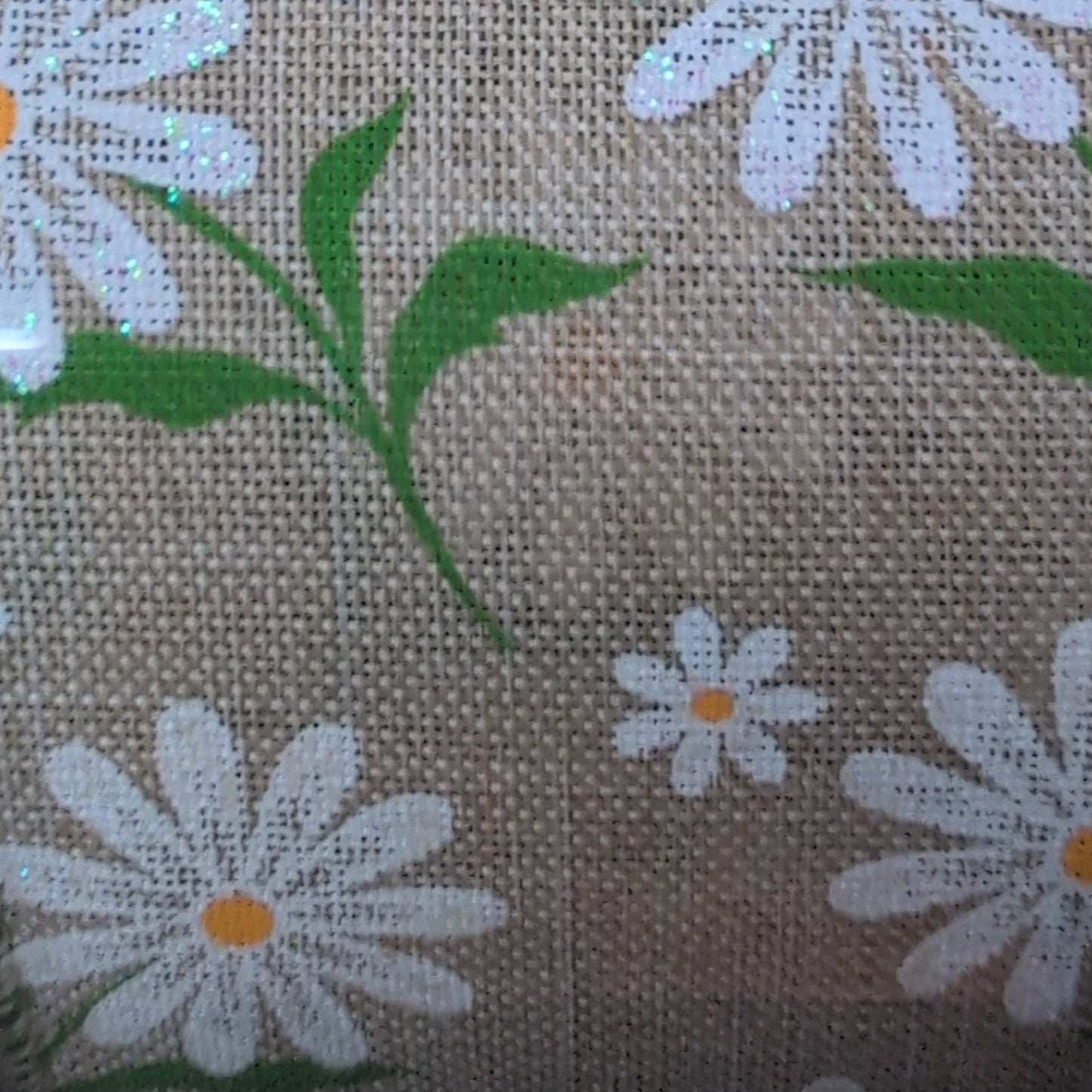 Roll of ribbon with floral pattern on a beige background