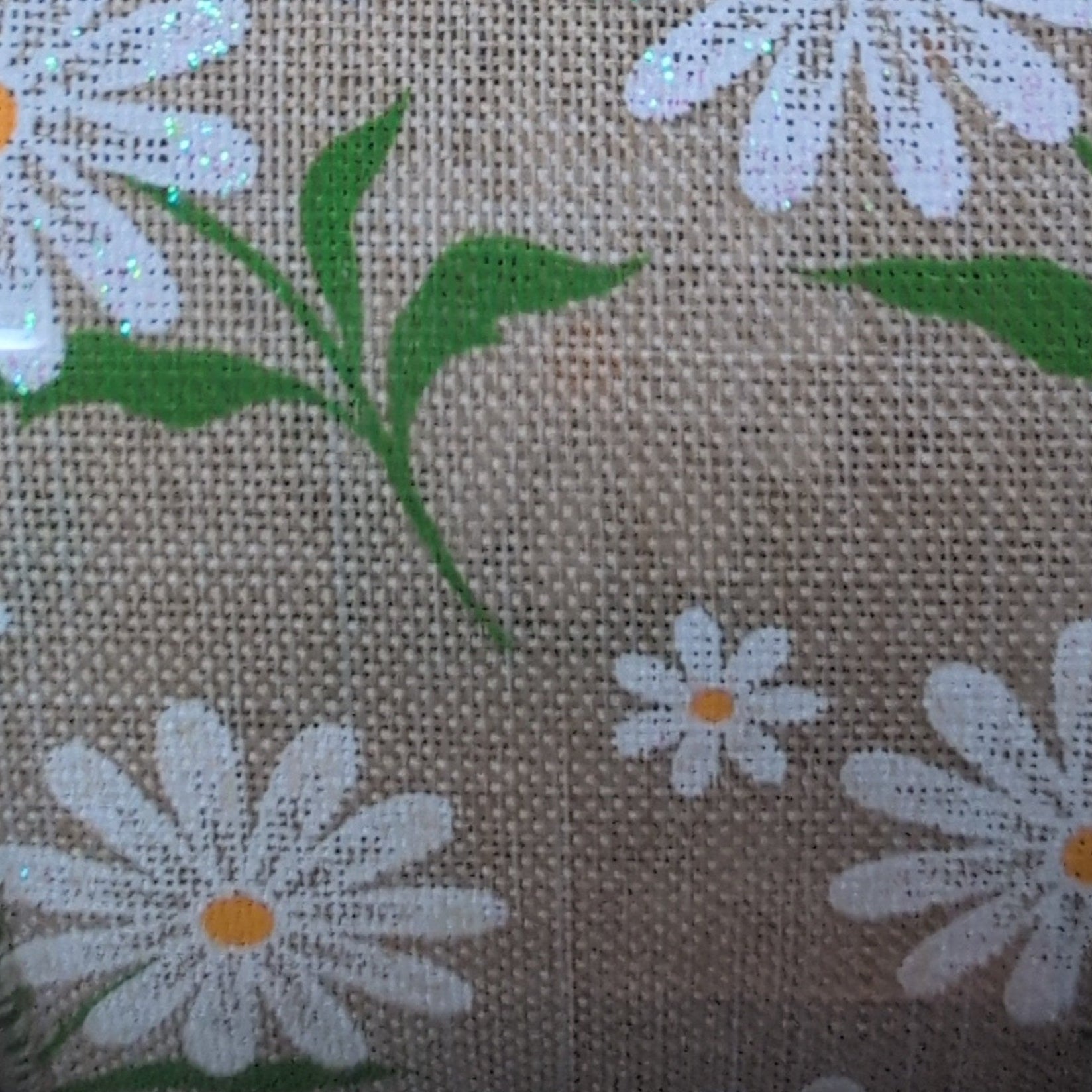Roll of ribbon with floral pattern on a beige background