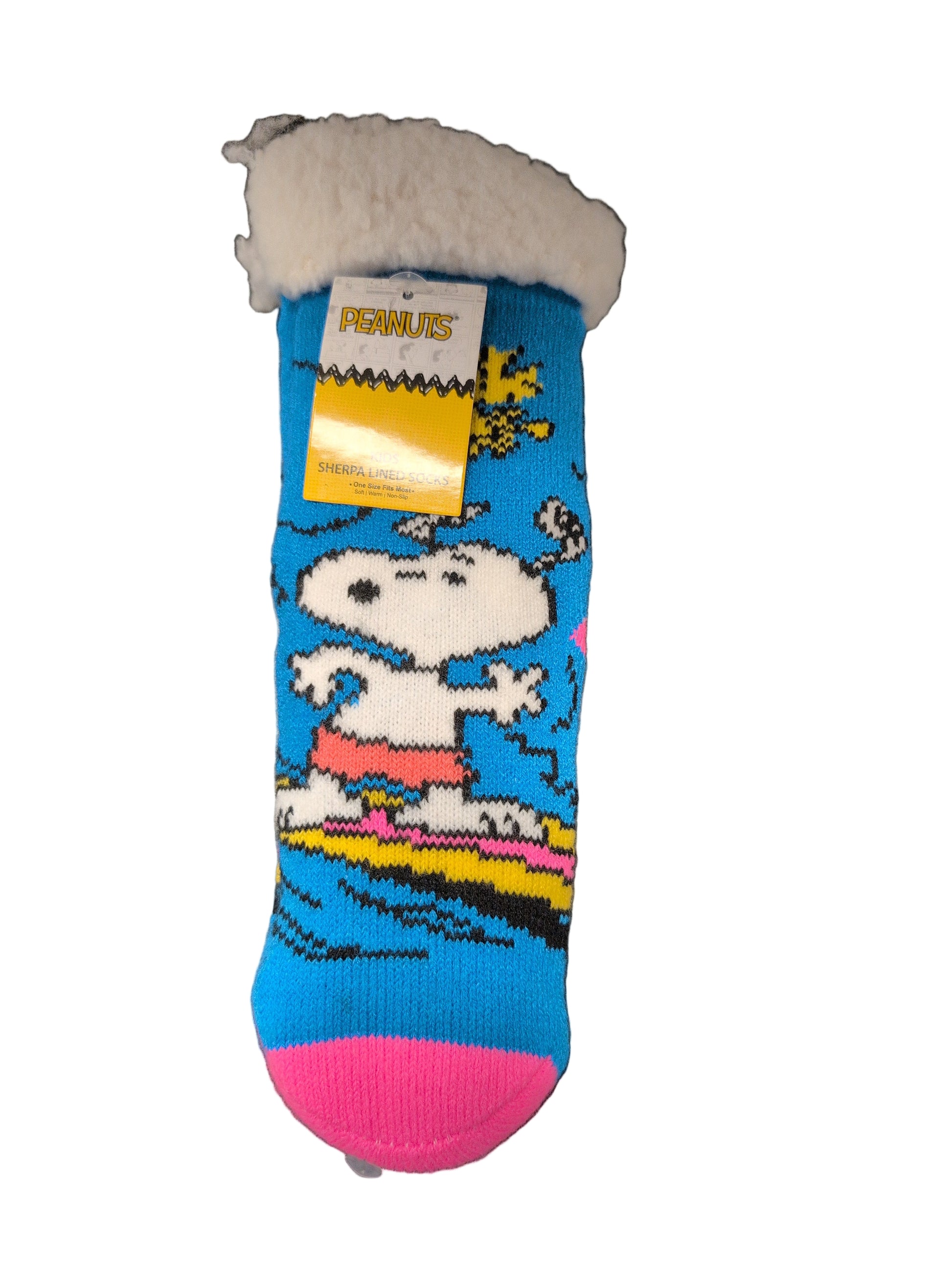 Colorful sock with cartoon design on a dark surface