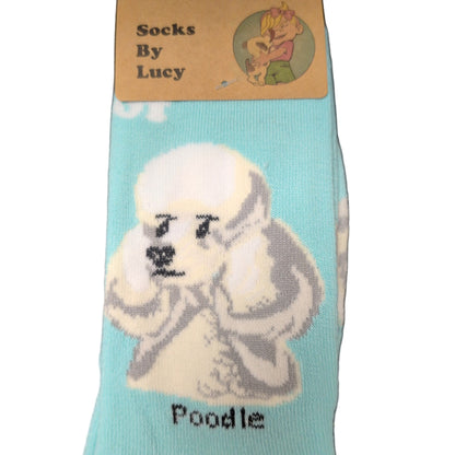 Teal sock with a dog design and label on a dark surface