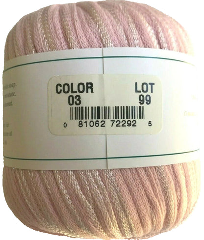 Ball of yarn with a label showing color and lot number on a white background