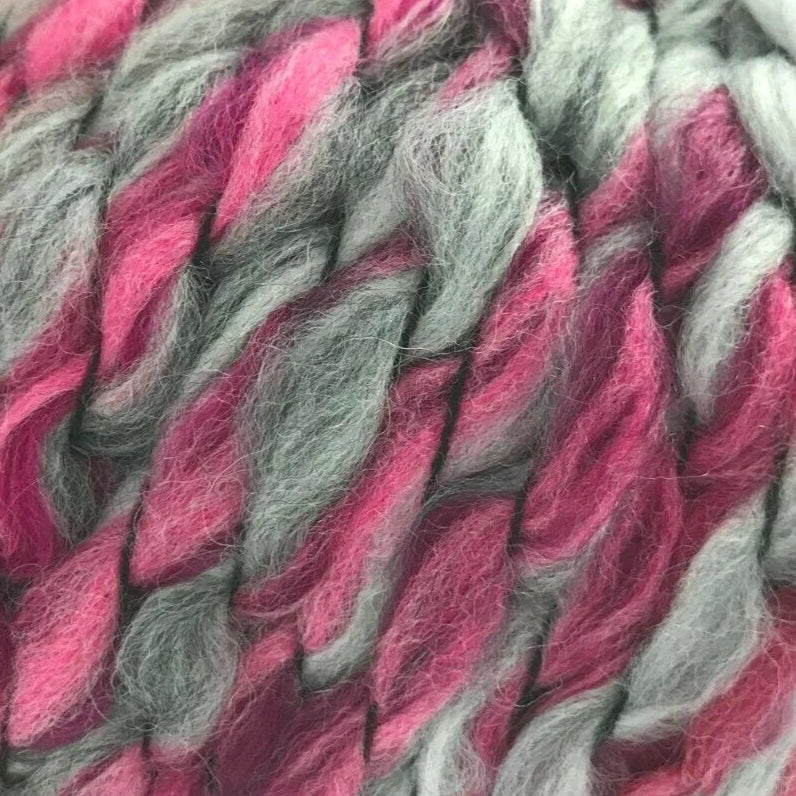 Close-up of pink and gray yarn strands