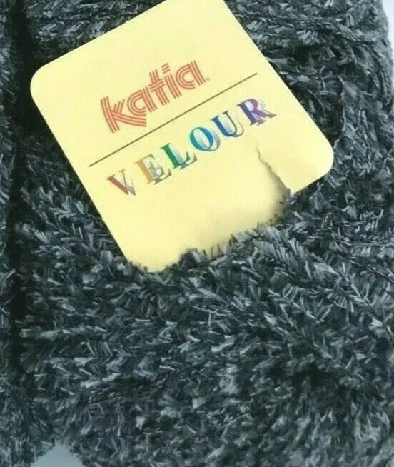Katia Velour yarn label on a ball of dark gray yarn