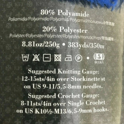 Blue yarn ball with label on a white background