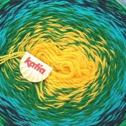 Green and blue skein of yarn with a yellow center, featuring the Kattai brand logo.