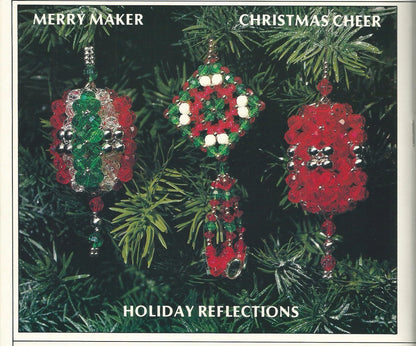 Decorative Christmas ornaments on a green leaf background with text 'Merry Maker Christmas Cheer' and 'Holiday Reflections'.