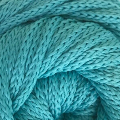 Close-up of teal yarn with a textured pattern