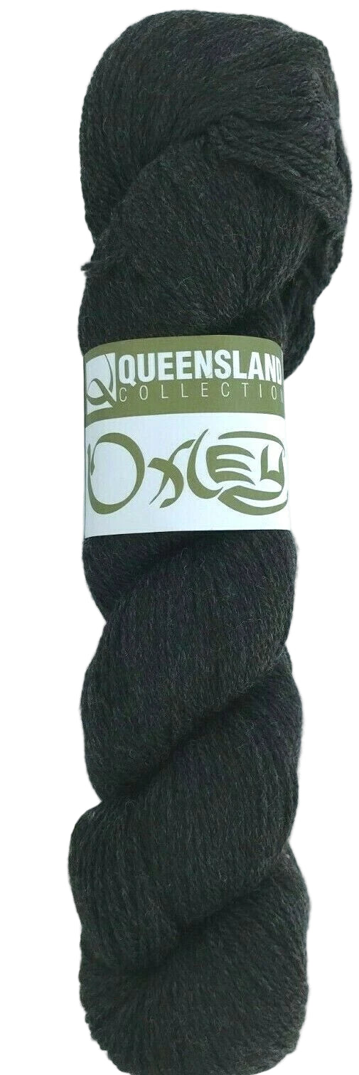 Dark gray skein of yarn with a label on a white background
