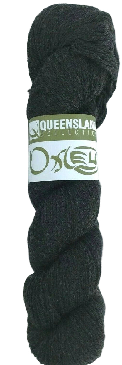 Dark gray skein of yarn with a label on a white background