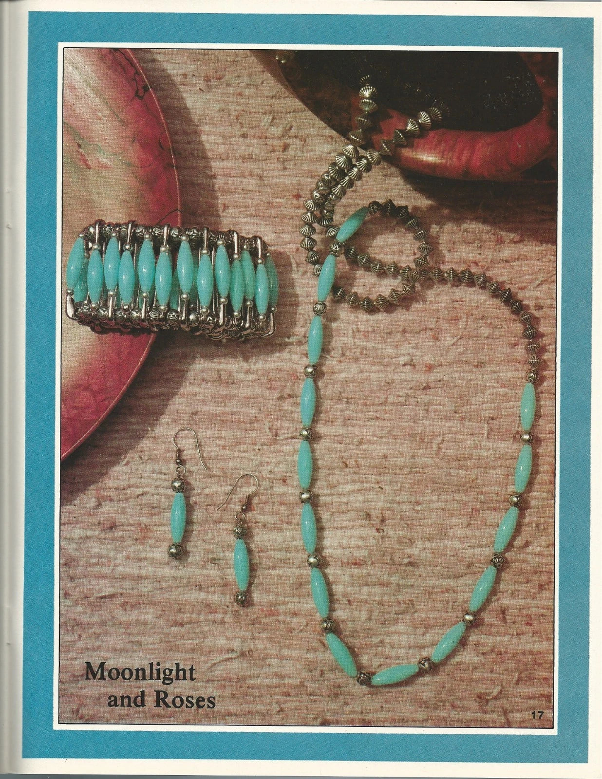 Turquoise beaded jewelry set with 'Moonlight and Roses' text on a textured surface.