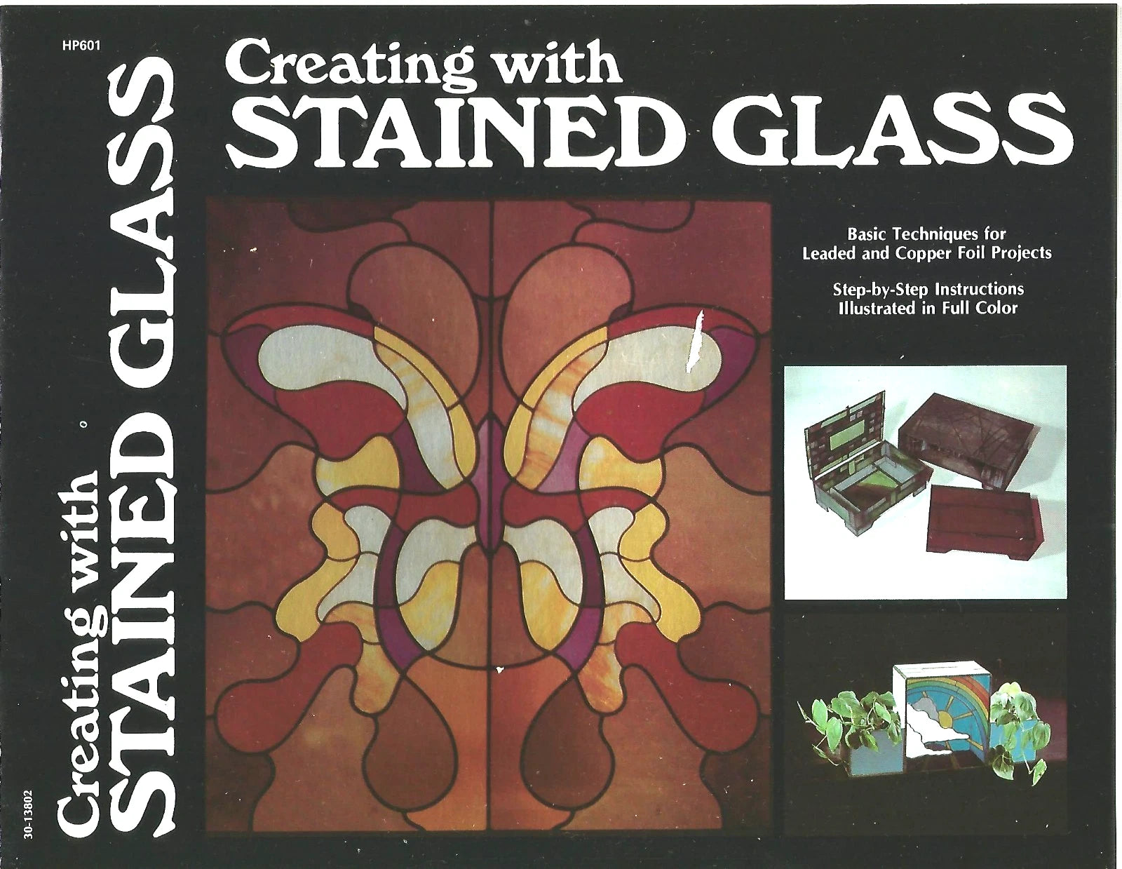 Book cover of 'Creating with Stained Glass' featuring a stained glass design and text.