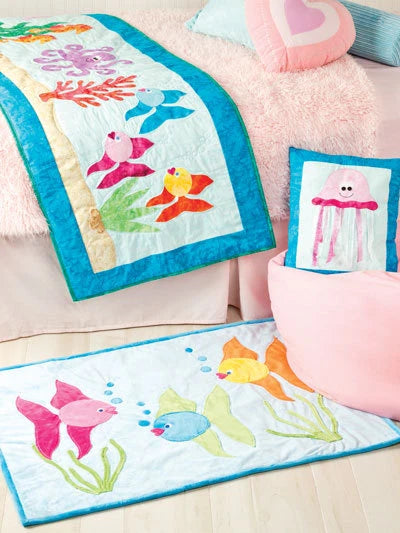 Children's room with colorful fish-themed quilt and pillows on a bed.
