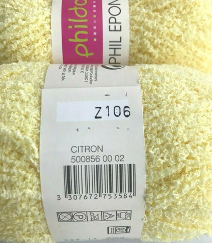 Close-up of a ball of yellow yarn with a label on top