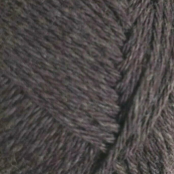 Close-up of textured brown fabric with a herringbone pattern