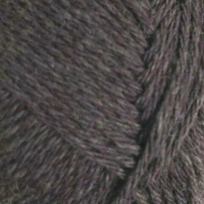 Close-up of textured brown fabric with a herringbone pattern
