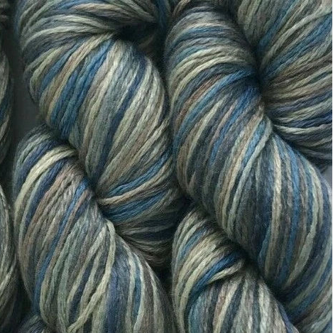 Close-up of blue and beige striped yarn skeins