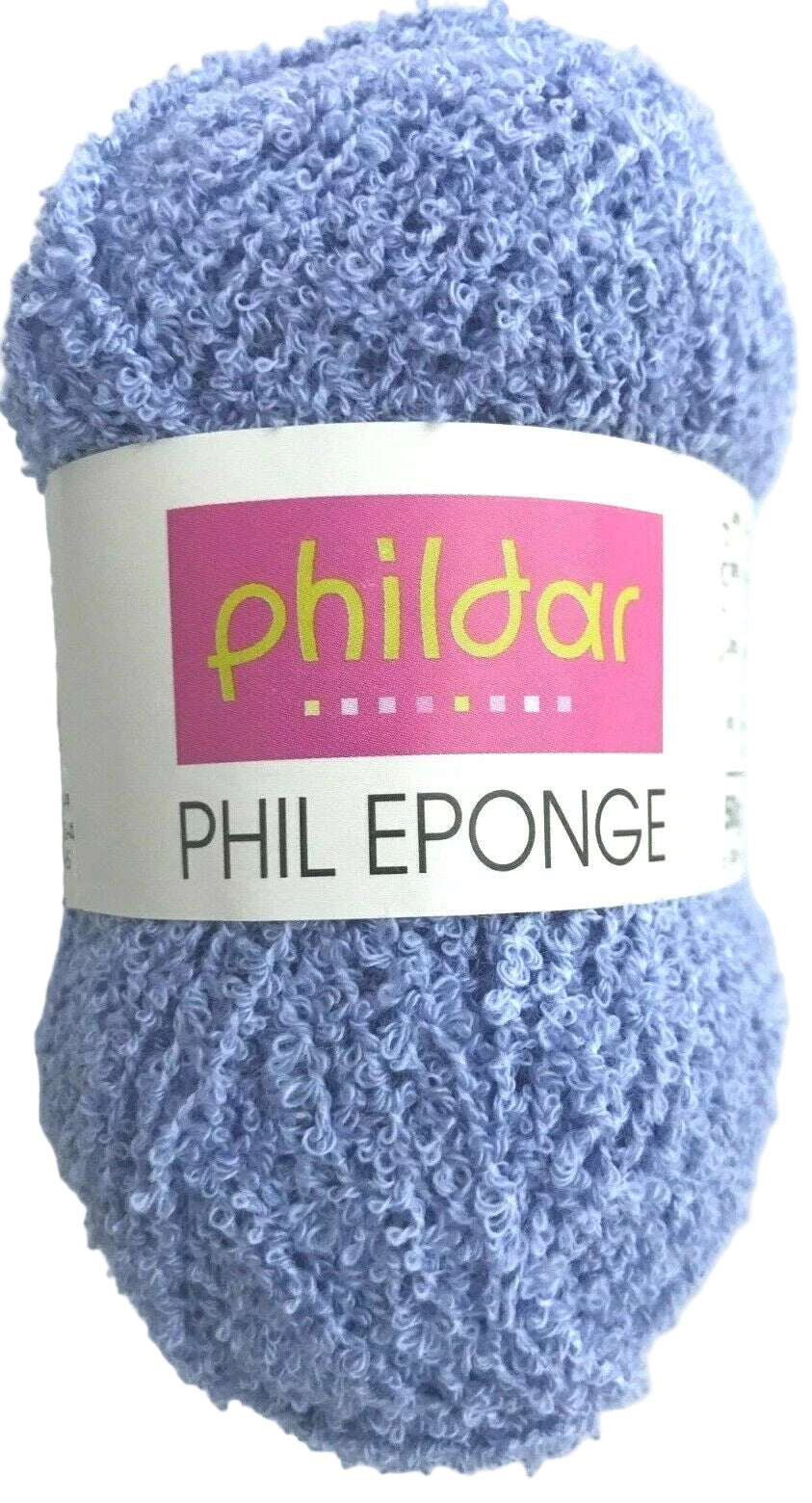 Ball of blue yarn with a Phildar label on a white background