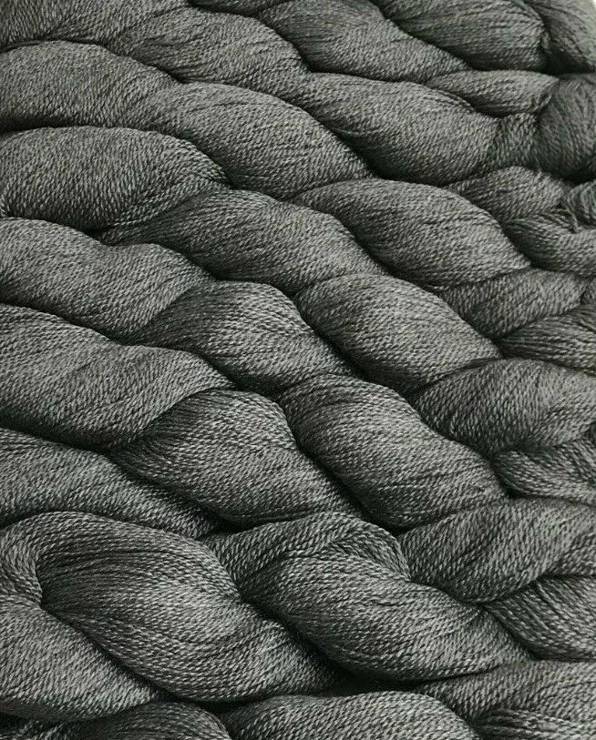 Close-up of gray braided rope texture