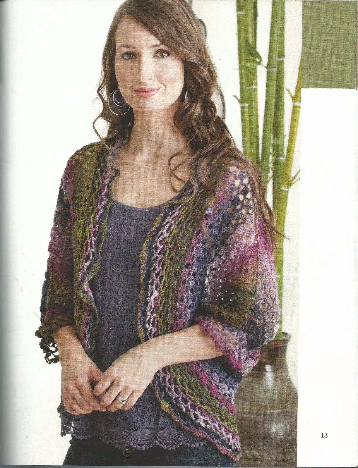 Woman wearing a colorful knitted cardigan with a blurred background