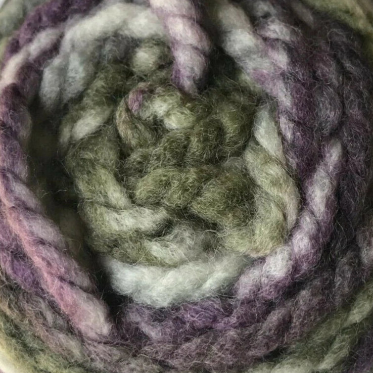 Close-up of a skein of green and purple yarn
