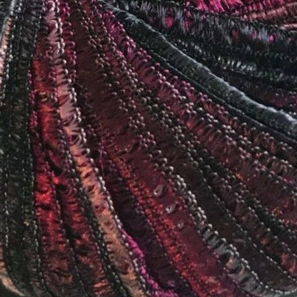 Close-up of textured fabric with red and black patterns