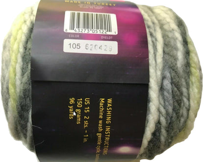 Ball of yarn with a label showing washing instructions and product details.