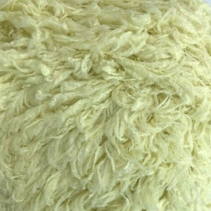 Close-up of light-colored shaggy carpet texture
