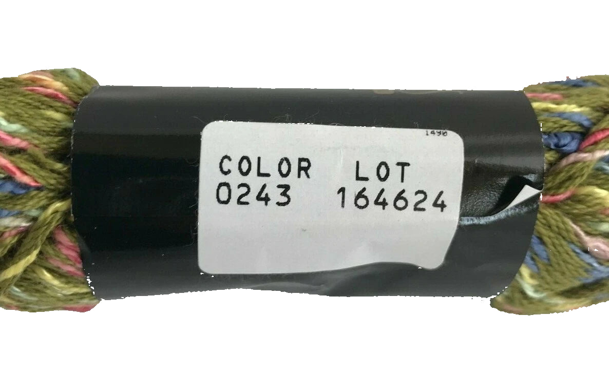 Spool of yarn with a label indicating color and lot number on a white background