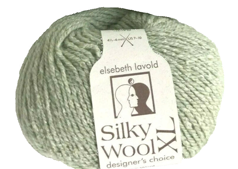 Ball of green yarn with 'elsebeth lavold Silky Wool' label on a white background