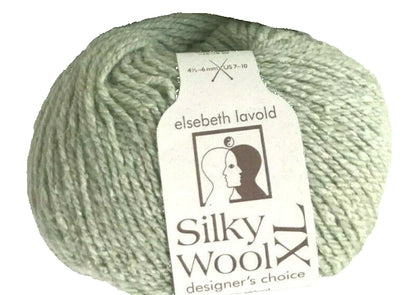 Ball of green yarn with 'elsebeth lavold Silky Wool' label on a white background