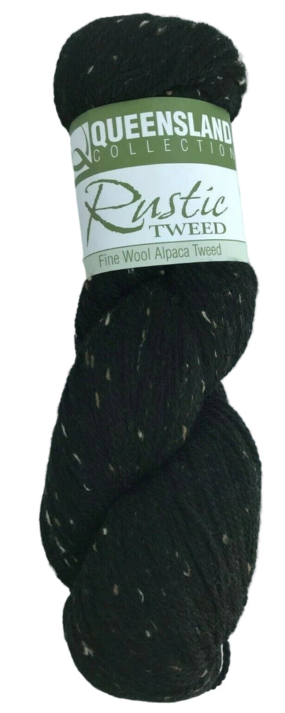Black yarn skein with a label on a white background