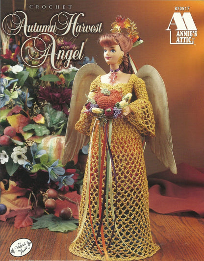 Crocheted angel doll with autumn-themed dress and flowers, featuring Annie's Attic branding.