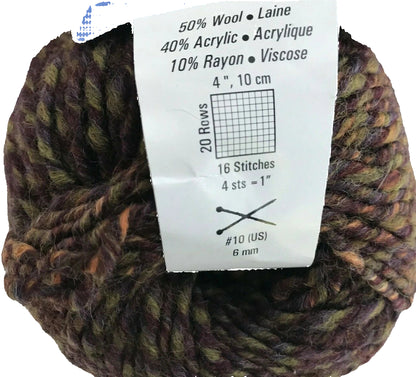 Ball of yarn with a label showing fiber content and knitting information on a white background