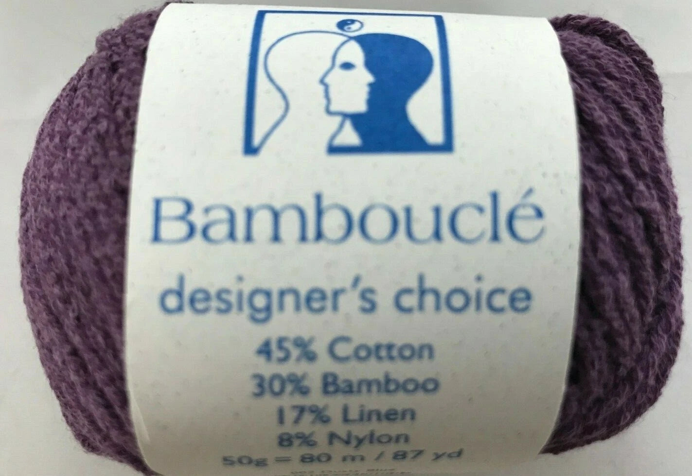 Ball of yarn with a label indicating 'Bambouclé' brand and composition details.