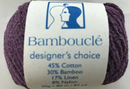 Ball of yarn with a label indicating 'Bambouclé' brand and composition details.