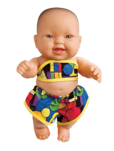 Baby doll wearing colorful outfit on a white background
