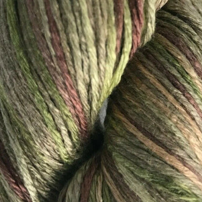Green and brown skein of yarn on a white background