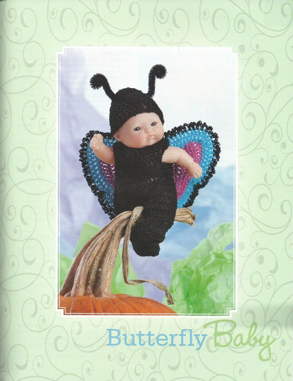 Toy dressed as a butterfly on a decorative card with 'Butterfly Baby' text.