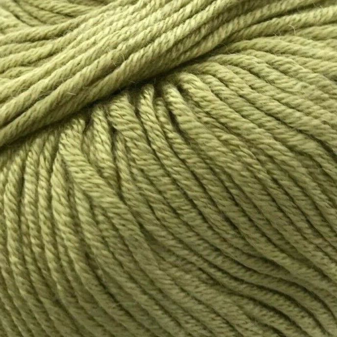 Ball of green yarn with a label on a white background