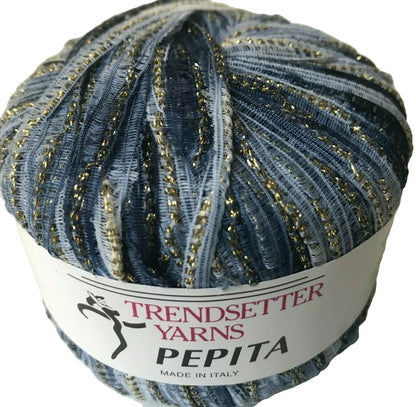 Ball of yarn with 'Trendsetter Yarns Pepita' label on a white background